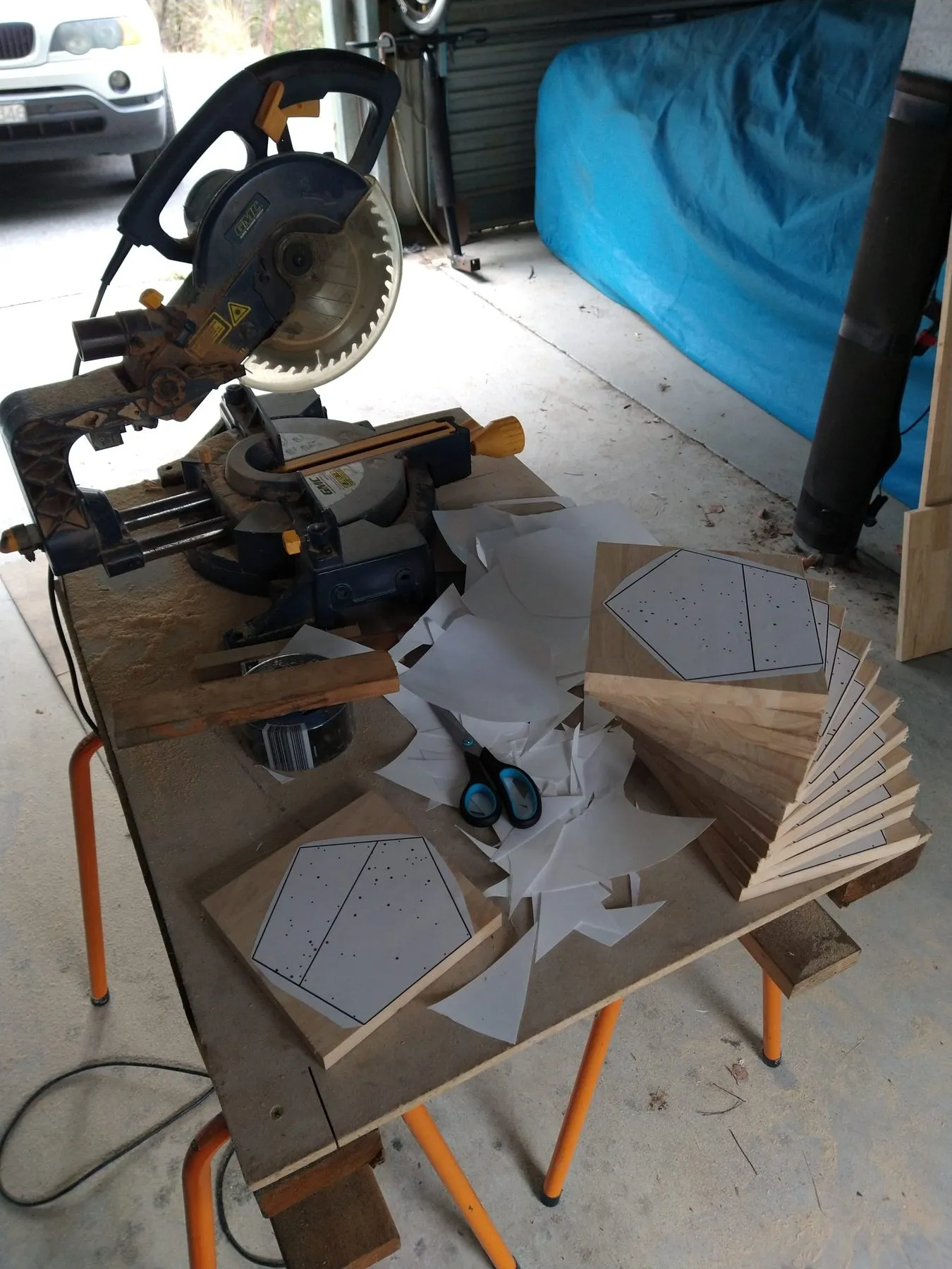 Pentagon blanks stacked by the drop saw in the workshop