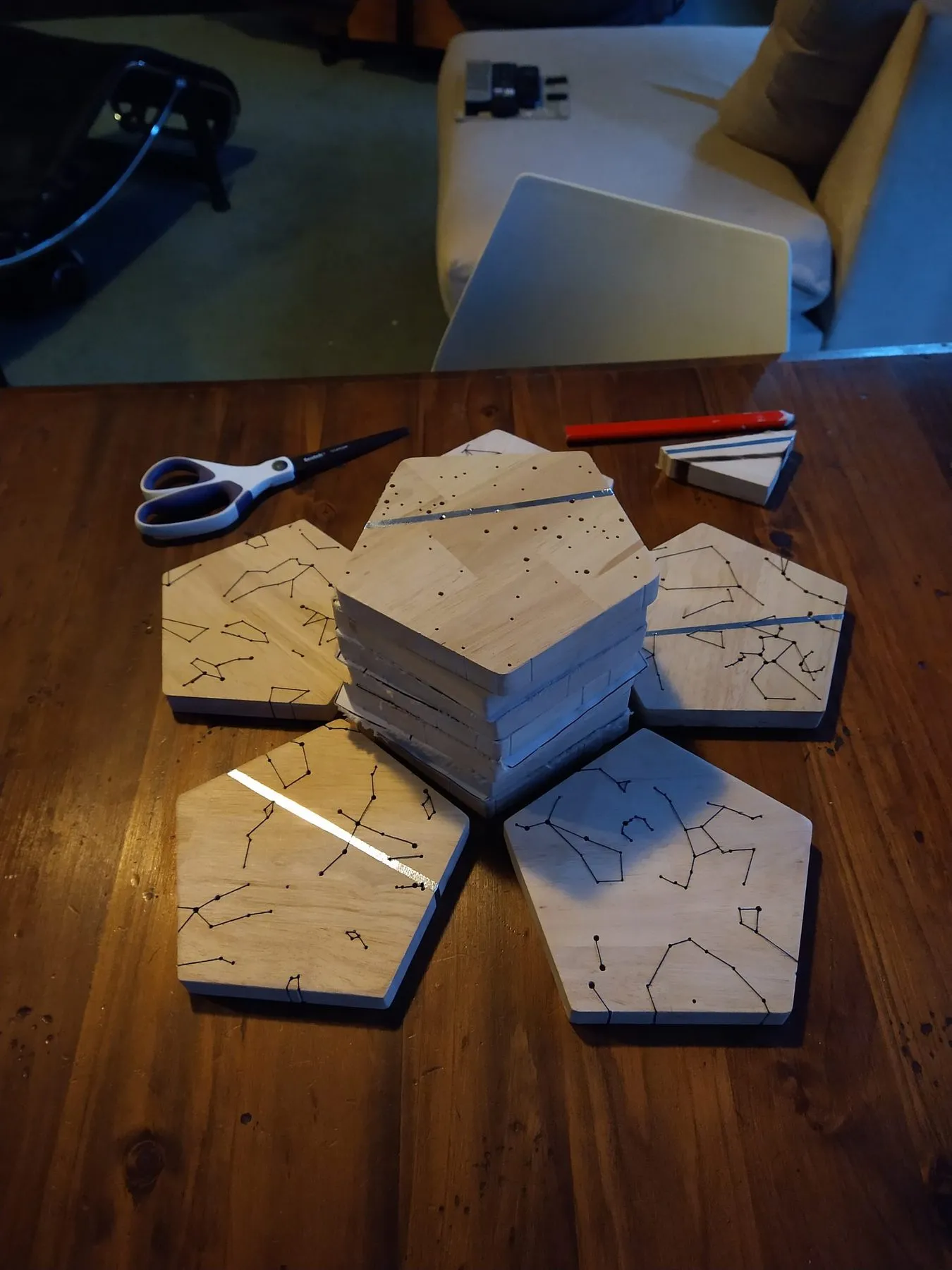Finished pentagons stacked on a wooden table